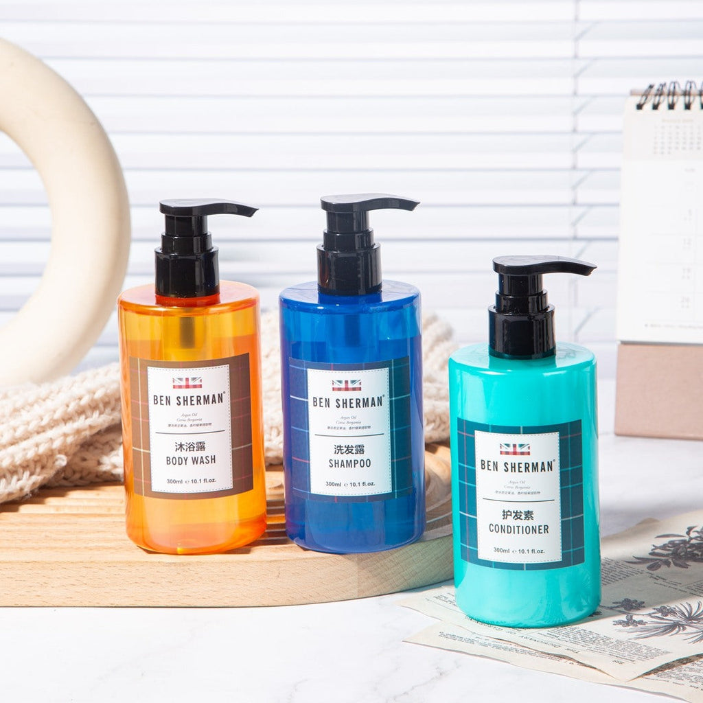 three bottles of BEN SHERMAN hotel toiletries.