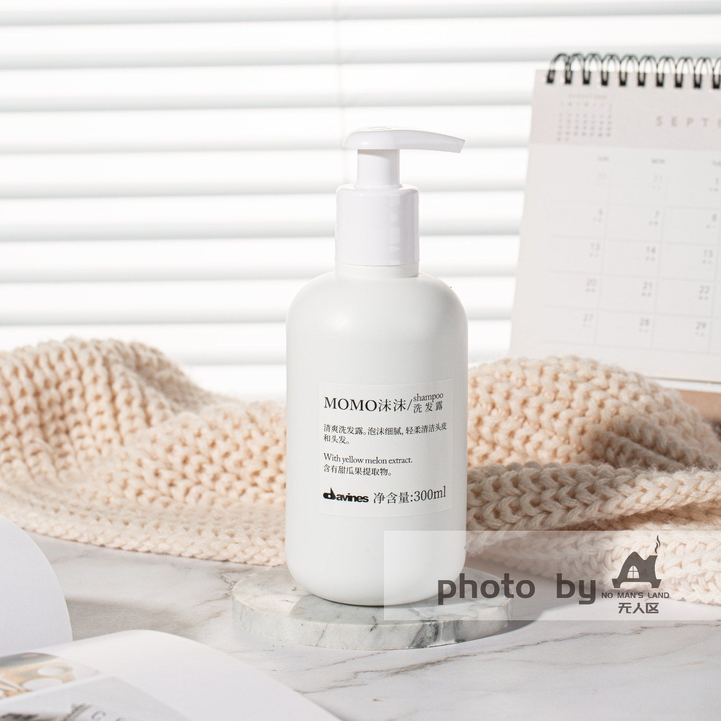 one bottle of DAVINES MOMO shampoo displayed.